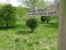 A wooden sign reads 