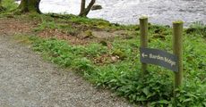 A grey metal sign reading 
